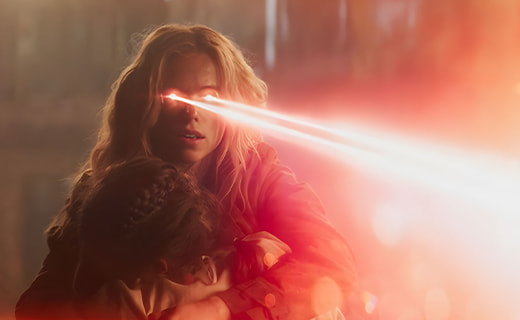 Woman with eyes shooting out laser