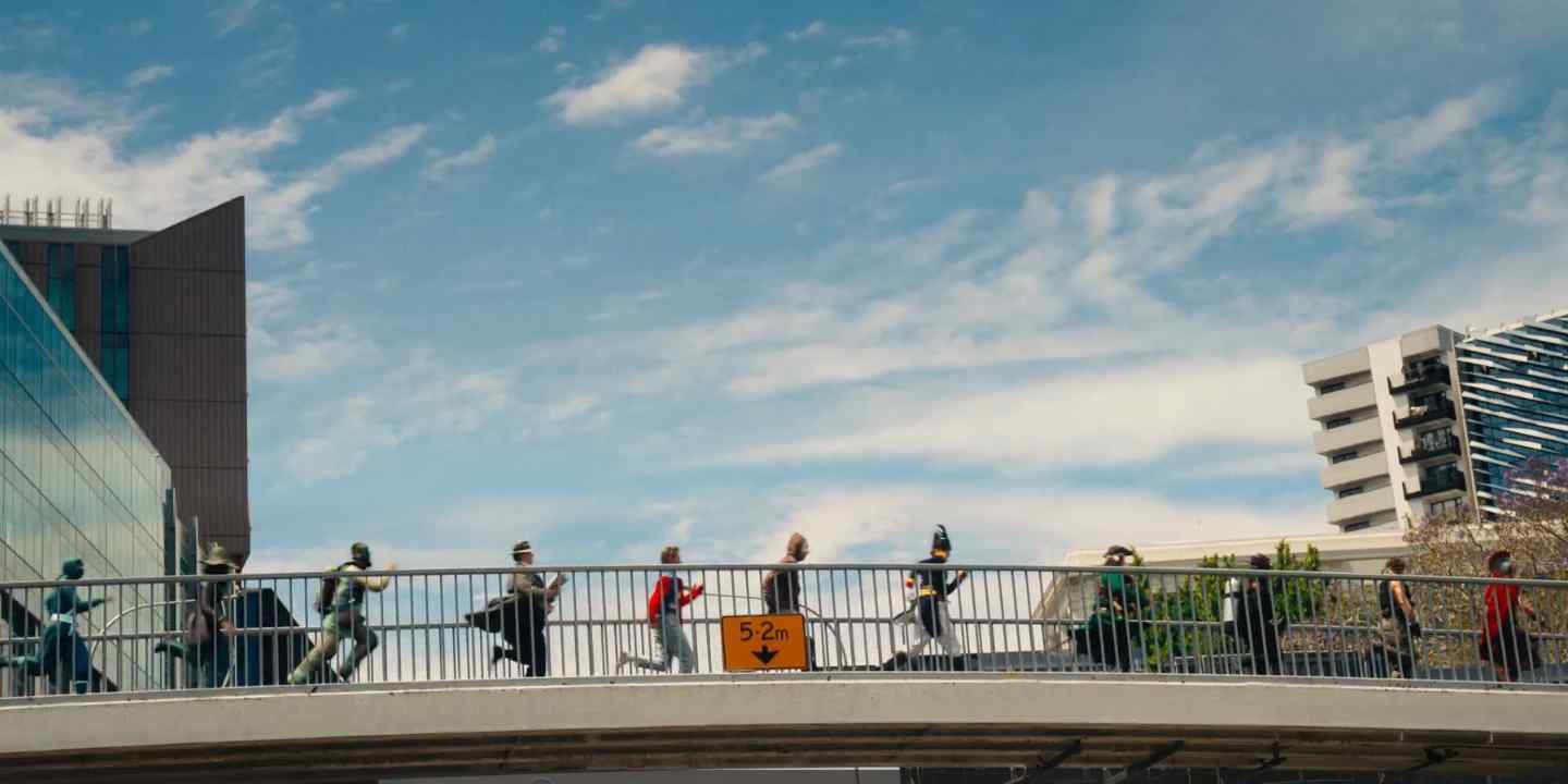 Characters running across a bridge